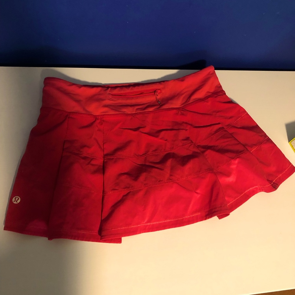 Lululemon tennis skirt. Pretty reddish color. Short style